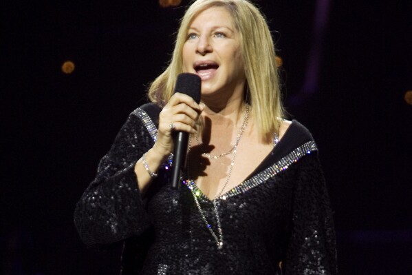 FILE - Barbra Streisand performs in Toronto, on Oct. 17, 2006. Published in early November, “My Name is Barbra” is a nearly 1,000 page memoir that covers one of the epic narratives in modern show business — her uncompromising rise from working class Brooklyn in the 1940s and '50s to global fame. (Adrian Wyld/The Canadian Press via AP, File)