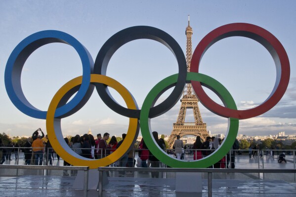 FILE - The Olympic rings are set up at Trocadero plaza that overlooks the Eiffel Tower in Paris on Sept. 14, 2017. A major French union is warning of possible strikes in the public sector, including at hospitals, during the Paris Olympics. The general secretary of the CGT tells France Info media that the union will give notice of a possible strike in public services during the Games, which are held in July-August. (AP Photo/Michel Euler, File)