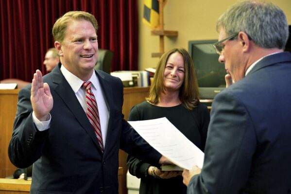 Washington County Circuit Court Clerk Kevin Tucker, right, swears in Andrew F. Wilkinson as a circuit court judge on Jan. 10, 2020, as Wilkinson's wife, Stephanie, watches. Wilkinson was found with apparent gunshot wounds around 8 p.m. Thursday, Oct. 19, 2023, the Washington County Sheriff’s Office said in a statement. Wilkinson was taken from his home in Hagerstown to Meritus Medical Center, where he died of his injuries, the sheriff's office said. ( Julie E. Greene/The Herald-Mail via AP)
