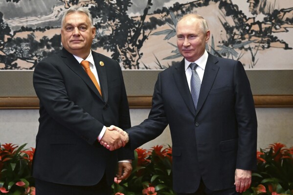 FILE - Russian President Vladimir Putin, right, and Hungarian Prime Minister Viktor Orban pose for a photo prior to their talks on the sidelines of the Belt and Road Forum in Beijing, China, on Tuesday, Oct. 17, 2023. Orban will be the center of attention at an EU summit Thursday, Oct. 26, 2023 following his meeting with Russian President Vladimir Putin last week. Diplomats say EU leaders will directly confront him with accusations he broke EU unity in their support of Ukraine. (Grigory Sysoyev, Sputnik, Kremlin Pool Photo via AP, File)