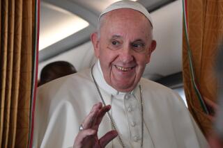 Pope Francis speaks with journalists on board an Alitalia aircraft enroute from Bratislava back to Rome, Wednesday, Sept. 15, 2021 after a four-day pilgrimage to Hungary and Slovakia. (Tiziana Fabi, Pool via AP)