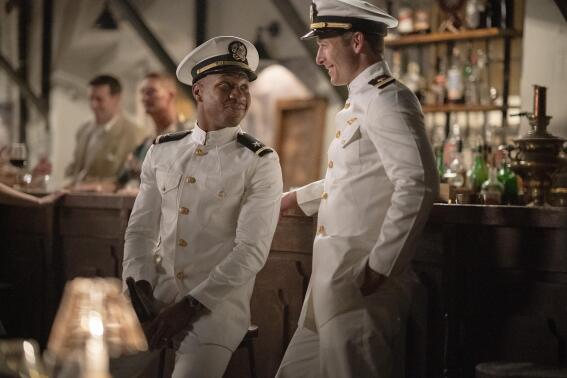 This image released by Sony Pictures shows Jonathan Majors, left, and Glen Powell in a scene from "Devotion." (Eli Ade/Columbia Pictures-Sony via AP)