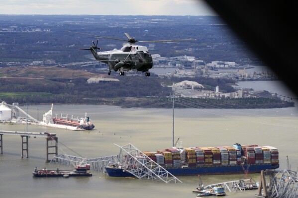 President Joe Biden, aboard Marine One, takes an aerial tour of the collapsed Francis Scott Key Bridge in Baltimore, Friday, April 5, 2024, as seen from an accompanying aircraft. (AP Photo/Manuel Balce Ceneta)
