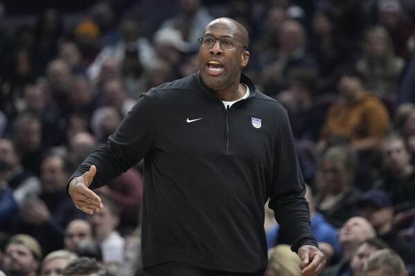 FILE - Sacramento Kings coach Mike Brown gestures during the first half of the team's NBA basketball game against the Cleveland Cavaliers, Feb. 5, 2024, in Cleveland. The Kings have agreed to a extension with Brown to keep him under contract through the 2026-27 season, a person familiar with the deal said Friday, May 31. (AP Photo/Sue Ogrocki, File)