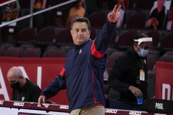 Arizona head coach Sean Miller waves after a win over Southern California during an NCAA college basketball game Feb. 20, 2021, in Los Angeles.  Former Arizona coach Miller returned to Xavier on Saturday, March 19, 2022, less than a year after the Wildcats fired him amid an ongoing NCAA investigation that has stretched nearly five years. (AP Photo/Marcio Jose Sanchez, File)