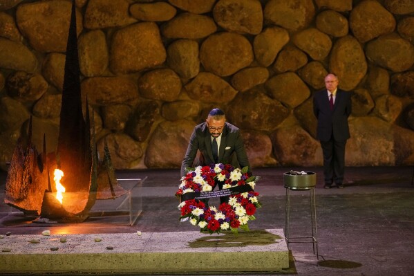 Britain's Secretary of State for Foreign, Commonwealth and Development Affairs, James Cleverly places a wreath in the Hall of Remembrance during his visit to the Yad Vashem World Holocaust Remembrance Center in Jerusalem, Monday, Sept. 11, 2023. (AP Photo/Ohad Zwigenberg)