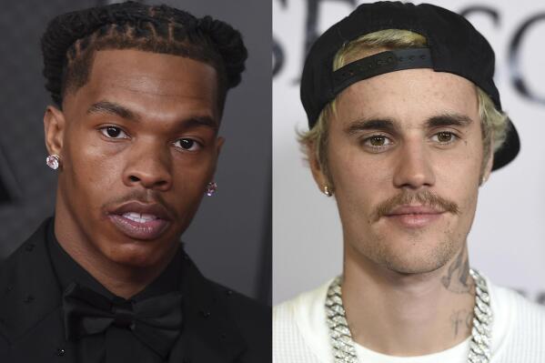 Lil Baby appears in the press room at the 63rd annual Grammy Awards on March 14, 2021in Los Angeles, left, and  Justin Bieber appears at the Los Angeles premiere of "Justin Bieber: Seasons" on Jan. 27, 2020. The pair are set to headline Jay-Z's Made in America festival in Philadelphia. Organizers announced Monday that Megan Thee Stallion, Doja Cat, Roddy Ricch, Bobby Shmurda and A$AP Ferg will also perform at the two-day event on Sept. 4-5 over Labor Day Weekend. (Photos by Jordan Strauss/Invision/AP)