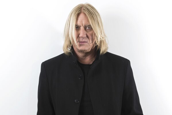 
              FILE - In this Jan. 23, 2018 file photo, Def Leppard singer Joe Elliott appears during a photo shoot in New York.  Def Leppard will be inducted into the Rock & Roll Hall of Fame on Friday. (Photo by Brian Ach/Invision/AP)
            