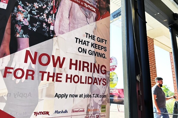 FILE - A hiring sign is displayed at a retail store in Vernon Hills, Ill., Thursday, Aug. 31, 2023. A year ago, Chair Jerome Powell warned that the Fed was prepared to be similarly aggressive toward high inflation, saying its rate hikes would cause “some pain” in the form of higher unemployment. Over time, as the job market has displayed surprising resilience, Powell has adopted a more benign tone. At a news conference last week, he suggested that a soft landing remains a “possible," if not guaranteed, outcome. (AP Photo/Nam Y. Huh, File)