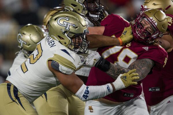 FILE - Georgia Tech defensive lineman Sylvain Yondjouen (32) works against Boston College offensive lineman Tyler Vrabel (78) during the second half of an NCAA college football game Nov. 13, 2021, in Atlanta. One player has been off limits for Tennessee Titans coach Mike Vrabel when preparing for the draft with general manager Jon Robinson: his oldest son Tyler. (AP Photo/Danny Karnik, File)