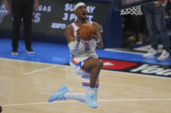 Oklahoma City Thunder guard Shai Gilgeous-Alexander does up to score against the Indiana Pacers during the second half of Game 5 of the NBA Finals basketball series, Monday, June 16, 2025, in Oklahoma City. (AP Photo/Nate Billings)