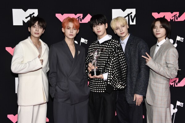 Tomorrow X Together, winners of the award for push performance of the year for "Sugar Rush Ride," arrive at the MTV Video Music Awards on Tuesday, Sept. 12, 2023, at the Prudential Center in Newark, N.J. (Photo by Evan Agostini/Invision/AP)