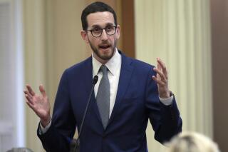 FILE - In this June 28, 2018, file photo, state Sen. Scott Weiner, D-San Francisco, talks during a Senate session in Sacramento, Calif. The Assembly Public Safety Committee approved Weiner's measure decriminalizing psychedelic substances, Tuesday June 29, 2021, after he amended his bill to remove a substance from the measure that opponents said can be used as a date-rape drug. (AP Photo/Rich Pedroncelli, File)