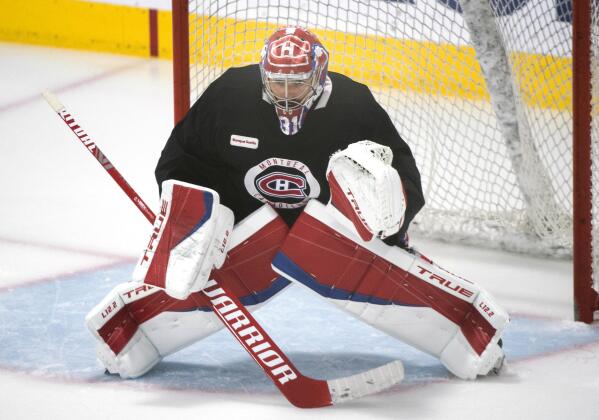 Montreal Canadiens goaltender Carey Price eyes the play during practice  in Brossard, Quebec, Sunday, June 27, 2021. The Canadiens take on the Tampa Bay Lightning in the NHL hockey Stanley Cup finals beginning Monday in Tampa, Fla. (Graham Hughes/The Canadian Press via AP)