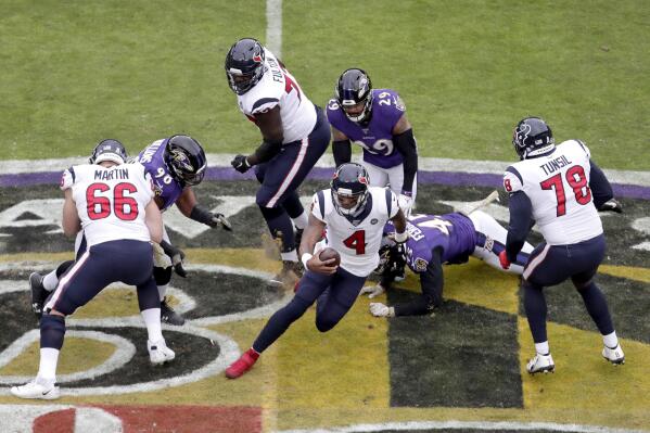 Houston Texans quarterback Deshaun Watson (4) scrambles against the Baltimore Ravens during the first half of an NFL football game, Sunday, Nov. 17, 2019, in Baltimore. (AP Photo/Julio Cortez)