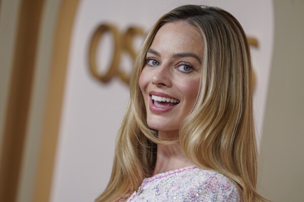Margot Robbie arrives at the Oscar Nominees Luncheon at the 96th Academy Awards on Monday, February 12, 2024, at the Beverly Hilton Hotel in Beverly Hills, Calif. (Photo by Jordan Strauss/Invision/AP)