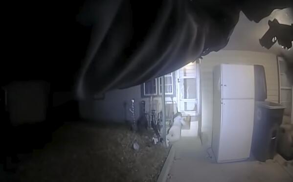 This image from police body cam video provided by the City of Lawton, OKla., shows police approaching Quadry Sanders after being shot by police on Dec. 5, 2021. Two former Oklahoma police officers were charged with first-degree manslaughter on Friday, May 6, 2022, in the fatal shooting of Sanders in December while responding to a 911 call of an alleged protective order violation. (City of Lawton via AP)