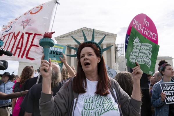 FILE - Abortion-rights activists rally outside the Supreme Court, Wednesday, April 24, 2024, in Washington. Voters in four states will consider adding abortion protections to their state constitutions this year, and there are pushes for measures in several others. (AP Photo/Jose Luis Magana, File)