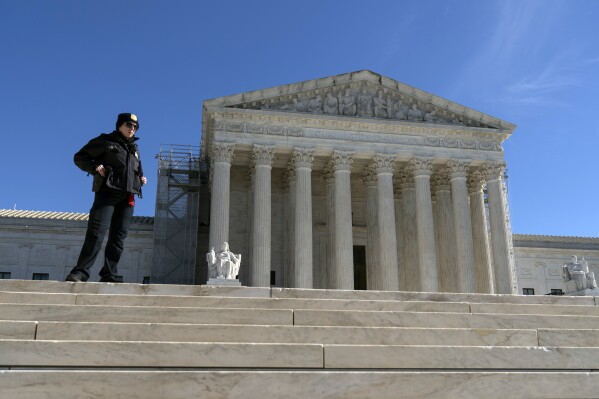 A U.S. Supreme Court police officer stands in fron of the U.S. Supreme Court Wednesday, Feb. 7, 2024, in Washington. (AP Photo/Jose Luis Magana)
