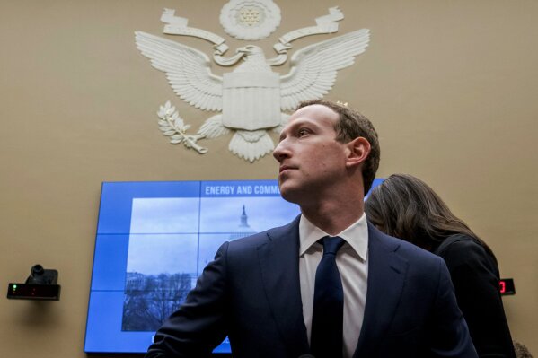 FILE - In this April 11, 2018, file photo, Facebook CEO Mark Zuckerberg arrives to testify before a House Energy and Commerce hearing on Capitol Hill in Washington. Facebook said Tuesday, Sept. 17, 2019, that it expects to name the first members of a new quasi-independent oversight board by year-end. The oversight panel, which the social network first discussed publicly last November, will rule on thorny content issues, such as when Facebook or Instagram posts constitute hate speech. (AP Photo/Andrew Harnik, File)