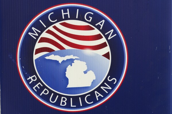 A sign is displayed at the Michigan Republican Party Convention, Saturday, Feb. 22, 2025, in Detroit. (AP Photo/Paul Sancya)