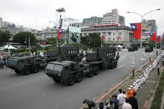 FILE - Taiwan's U.S.-made Patriot surface to air missile batteries pass during the Republic of China National Day parade in Taipei, Taiwan on Oct. 10, 2007. The Biden administration has approved a $100 million support contract with Taiwan aimed at boosting the island’s missile defense systems as it faces increasing pressure from China. (AP Photo/Wally Santana, File)