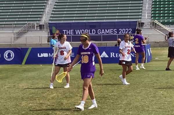 FILE - Lois Garlow of the Haudenosaunee Nationals lacrosse team heads toward the sideline during a match against Canada at the World Games in Birmingham, Ala., July 24, 2022. President Joe Biden is pushing for the Indigenous nation that invented lacrosse to be able to play under its own flag when the sport returns to the Olympics in 2028. Biden's position, being announced Wednesday at the White House Tribal Nations Summit, is a request for the International Olympic Committee to allow the Haudenosaunee Nationals to compete as its own team at the Los Angeles Games. (AP Photo/Paul Newberry, File)