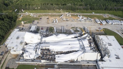 Debris is scattered around the Pfizer facility on Wednesday, July 19, 2023, in Rocky Mount, N.C., after damage from severe weather. (Travis Long/The News & Observer via AP)