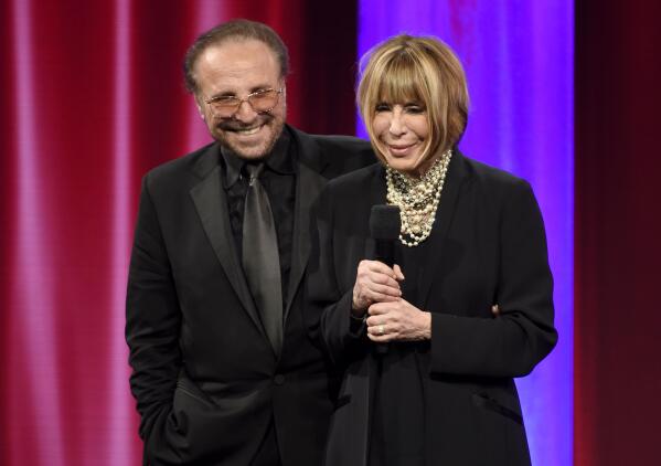 FILE - Barry Mann, left, and Cynthia Weil accept the BMI Icon award at the 64th annual BMI Pop Awards on, May 10, 2016, in Beverly Hills, Calif. Weil, a Grammy-winning lyricist of great range and endurance who enjoyed a decades-long partnership with husband Barry Mann and helped write "You've Lost That Lovin' Feeling," "On Broadway," "Walking in the Rain" and dozens of other hits, has died at age 82. Weil and Mann, married in 1961, were one of popular music's most successful teams. (Photo by Chris Pizzello/Invision/AP, File)