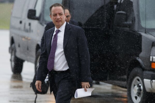 
              FILE - In this July 28, 2017, file photo, then-White House Chief of Staff Reince Priebus walks to boards Air Force One at Andrews Air Force Base, Md. For an administration that has spent 2017 throwing off headlines at a stunningly dizzying pace, the frenetic fortnight in the second half of July reached an unparalleled breakneck speed. Set amid the backdrop of a president grappling with his deepest insecurities, the West Wing’s breakdown in policy collided with its collapse in personnel and acted as a crucial inflection point for Trump’s first year in office. Buffeted by fierce rains and wind, Air Force One circled in the skies above Washington on July 28. When it finally touched down at Joint Base Andrews, a presidency had been forever altered. In a series of tweets, Trump announced a decision that had been reached the night before, that he was appointing John Kelly, a retired Marine four-star general, to be his new chief of staff, replacing Priebus. (AP Photo/Evan Vucci)
            