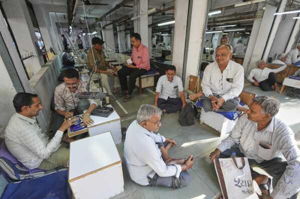 Diamond traders conduct business at a market in Surat, India, on April 14, 2025. (AP Photo/Ajit Solanki)