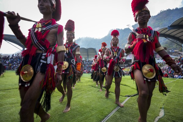 Indigenous Nagas dance during the Hornbill Festival in Kisama, on the outskirts of Kohima, capital of the northeastern Indian state of Nagaland, Tuesday, Dec. 10, 2024. (AP Photo/Anupam Nath)