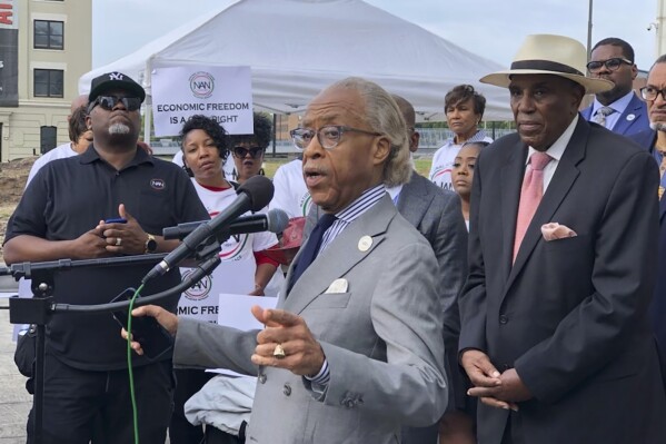 CORRECTS PHOTO CREDIT TO CURLAN CAMPBELL The Rev. Al Sharpton speaks outside the Richard B. Russell federal courthouse in Atlanta, on Tuesday, Sept. 26, 2023, in support of a grant program for Black women entrepreneurs. A judge ruled Tuesday that the program can continue, saying a lawsuit arguing it illegally excluded other races was not likely to succeed. (AP Photo/Curlan Campbell)
