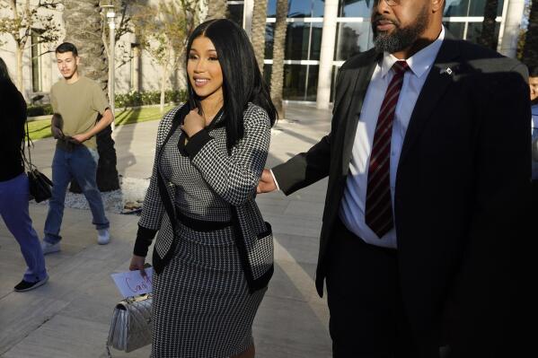 Cardi B exits federal court as proceedings continue in a $5 million copyright infringement lawsuit against her in federal court, Wednesday, Oct. 19, 2022, in Santa Ana, Calif. Kevin Michael Brophy is suing the Grammy-winning musician for allegedly misusing his likeness for her sexually suggestive mixtape cover art in 2016. (AP Photo/Chris Pizzello)