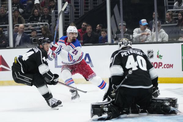 New York Rangers' Chris Kreider (20) scores against Los Angeles Kings goaltender Cal Petersen (40) during the third period of an NHL hockey game Tuesday, Nov. 22, 2022, in Los Angeles. The Rangers won 5-3. (AP Photo/Jae C. Hong)