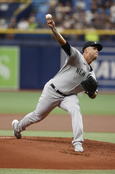 New York Yankees starting pitcher Jonathan Loaisiga stands on the