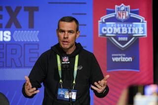 FILE - Buffalo Bills general manager Brandon Beane speaks during a press conference at the NFL football scouting combine in Indianapolis, Tuesday, March 1, 2022. Beane has a decision to weigh as to whether to stick with the players he’s familiar with or plug the team’s needs in free agency, and with little room to maneuver under the salary cap. (AP Photo/Michael Conroy, File)