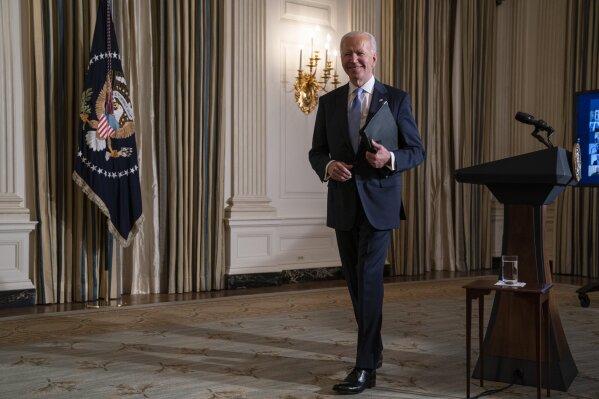 FILE - In this Jan. 20, 2021, file photo, President Joe Biden leaves after attending a virtual swearing in ceremony of political appointees from the State Dining Room of the White House in Washington. The United States will resume funding for the World Health Organization and join its consortium aimed at sharing coronavirus vaccines fairly around the globe, Biden’s top adviser on the pandemic said Thursday, Jan. 21. (AP Photo/Evan Vucci, File)