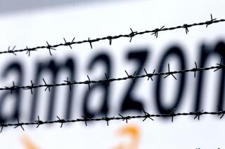 FILE - In this Feb. 19, 2013 file photo, the internet trader Amazon logo is seen behind barbed wire at the company's logistic center in Rheinberg, Germany. A European Union court annulled Wednesday, May 12, 2021 a ruling by the European Commission that a tax deal between the Luxembourg government and Amazon amounted to illegal state support. The Commission's decision related to Luxembourg's tax treatment of two companies in the Amazon group, Amazon EU and Amazon Europe Holding Technologies. (AP Photo/Frank Augstein, File)