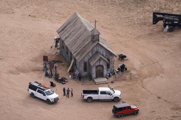 CORRECTS THAT SHOOTING OCCURRED DURING A REHEARSAL - FILE - This aerial photo shows the movie set of "Rust" at Bonanza Creek Ranch in Santa Fe, N.M., on Saturday, Oct. 23, 2021. Filming on the Western movie “Rust” could resume this week in Montana, the production company said Wednesday, April 19, 2023, in the aftermath of the fatal shooting of a cinematographer during a rehearsal with actor Alec Baldwin on the original production in New Mexico. (AP Photo/Jae C. Hong, File)