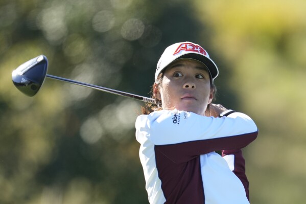 Celine Boutier of France watches her tee shot on the second hole during the final round of the BMW Ladies Championship at the Seowon Hills Country Club in Paju, South Korea, Sunday, Oct. 22, 2023. (AP Photo/Lee Jin-man)