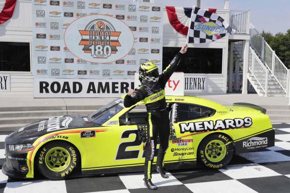 FILE - Austin Cindric reacts in Victory Lane after winning a NASCAR Xfinity Series auto race at Road America in Elkhart, Wisc., in this Saturday, Aug. 8, 2020, file photo. Road America owns a reputation as one of the nation’s foremost road courses, but it hasn’t hosted a NASCAR Cup Series event since the 1950s. That changes Sunday on the Fourth of July. (Gary C. Klein/The Sheboygan Press via AP, File)