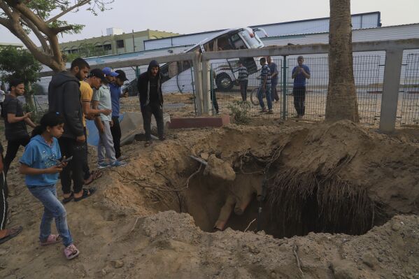 Palestinians inspect the site of an Israeli army airstrike on the European hospital in Khan Younis, Gaza Strip, Tuesday, May 13, 2025. The Israeli military said it had carried out a strike targeting what it said was a Hamas "command and control center" located beneath the hospital. (AP Photo/Mariam Dagga)