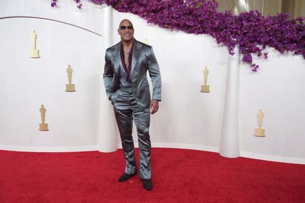 Dwayne Johnson arrives at the Oscars on Sunday, March 10, 2024, at the Dolby Theatre in Los Angeles. (Photo by Jordan Strauss/Invision/AP)