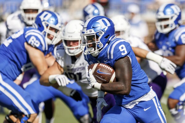 Duke's Jaquez Moore (9) carries the ball during the first half of an NCAA college football game against Northwestern in Durham, N.C., Saturday, Sept. 16, 2023. (AP Photo/Ben McKeown)