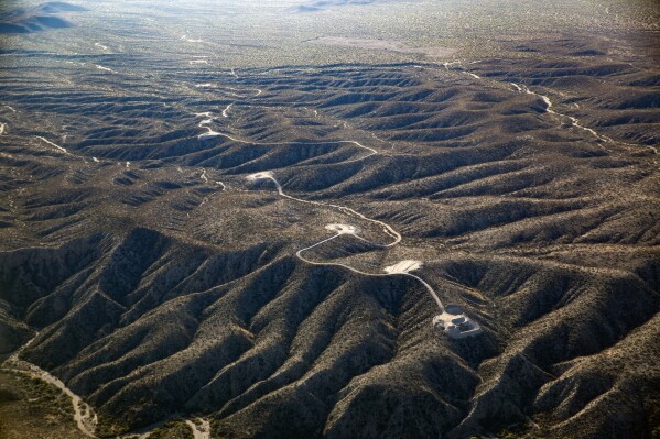 This aerial photo taken on Nov. 13, 2023, by Archaeology Southwest with a volunteer pilot and Lighthawk, a nonprofit organization, shows access roads and tower pad sites west of the San Pedro River, near Redrock Canyon, in Arizona. (Archaeology Southwest via AP)