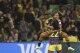 Colombia's Leicy Santos, up, and Colombia's Daniela Caracas celebrate at the end of the Women's World Cup round of 16 soccer match between Jamaica and Colombia in Melbourne, Australia, Tuesday, Aug. 8, 2023. (AP Photo/Hamish Blair)