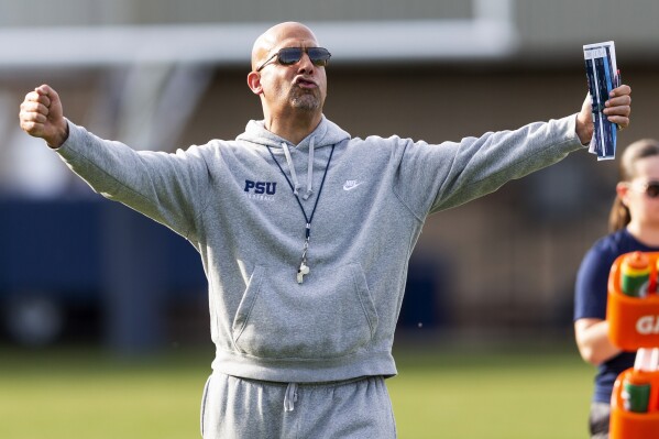 FILE - Penn State coach James Franklin gives instructions during the NCAA college football team's spring practice Tuesday April 4, 2023, in State College, Pa. Penn State opens their season at home against West Virginia on Sept. 2. (Joe Hermitt/The Patriot-News via AP, File)