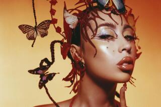 This cover image released by Geffen Records shows “Red Moon in Venus” by Kali Uchis. (Geffen Records via AP)