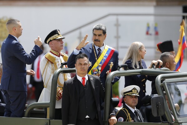 President Nicolas Maduro waves while riding in the back of a military vehicle during an Independence Day parade in Caracas, Venezuela, Friday, July 5, 2024. Venezuela is marking 213 years of independence from Spain. (ĢӰԺ Photo/Cristian Hernandez)